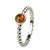 An oval of honey amber set in an artistic swirl of sterling silver.