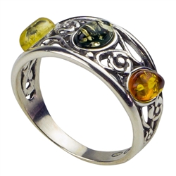 Artistic sterling silver ring highlighting three amber cabochons. Ring is about 0.4" wide.