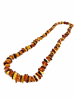 Multi-Color Amber Bead Necklace. Cognac, cherry, lemon, and butterscotch amber beads set on a durable string, finished with a screw clasp. The necklace is 18&#8243; long.