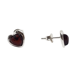 Cherry Amber Heart Stud Earrings. Heart-shaped amber stones set in .925 sterling silver. Genuine Baltic amber. Size is approx 04." x 0.4".