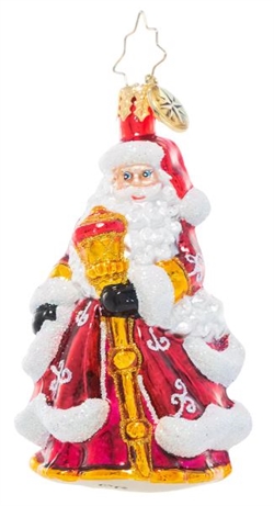 Santa Claus looks extra festive in his ruby red robes decorated with glittering white flourishes. He carries a gleaming golden staff to help light his way through the cold winter's night.
DIMENSIONS: 3 in (H) x 2 in (L) x 1.5 in (W)