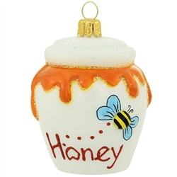 Overflowing with golden goodness, this honey pot glass ornament will make a great gift for your special "honey" or a wonderful addition to your food-themed tree! Skillfully crafted of glass in Poland with a variety of hand-painted hues, this sweet 3"