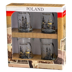 A set of four shot glasses decorated with scenes from the city of Krakow.. Hand Wash Only