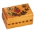 The lid of this box features a heart and flower design. Circular detailing around the sides completes the piece. Handmade in the Tatra Mountain region of Poland.