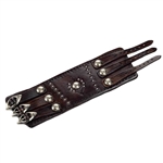 A solid piece of leather made this Wrist Band. It is adorned with nickel silver studs and buckles, and intricate tool worked designs in the leather . Made entirely by hand, this high quality piece is a work of art which any one would be proud to own. It