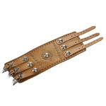 A solid piece of leather made this Wrist Band. It is adorned with nickel silver studs and buckles, and intricate tool worked designs in the leather . Made entirely by hand, this high quality piece is a work of art which any one would be proud to own. It
