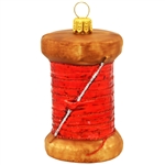 Hand-painted with vibrant glazes and a sparkling glitter accents, our charming 2Â¾" tall spool of thread ornament is skillfully crafted of glass in Poland and will look sew fantastic on your seamstress' or tailor's tree!