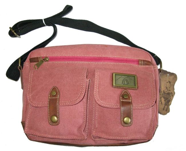 Canvas bag, long shoulder strap.  Front saddle bag pouches with snaps, lined interior with large zippered pockets plus exterior zippered pocket.