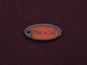 Rusted Iron Oval Miracles Pendant With One Hole