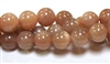 RB579-10mm STONE BEADS IN ORANGE MOONSTONE