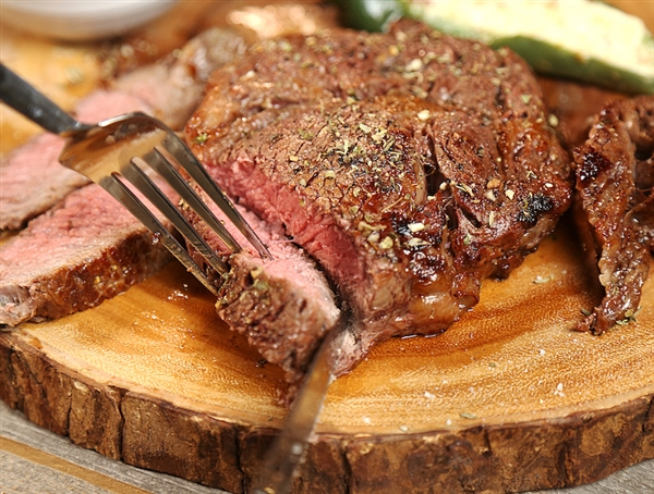 Ribeye served with creamy jalapeno corn