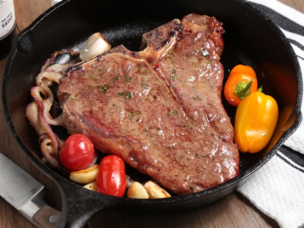 Rube's 20 oz T-bone cooked in a cast iron skillet.