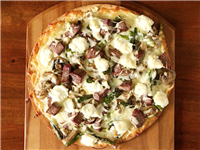 Steak and mushroom pizza with asparagus