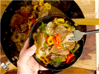 Loading bowl with sirloin and veggies