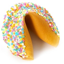 This Easter Gigantic fortune cookie is chocolate covered and decorated with fun flower candies for springing into spring.