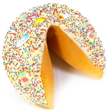 Gigantic fortune cookie covered in chocolate and decorated with pink, blue, yellow and white to welcome the new baby and congratulate the parents.