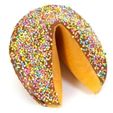 This Easter Gigantic fortune cookie is chocolate covered and decorated with pastel sprinkles for springing into spring.