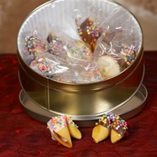 Traditional fortune cookies chocolate covered with pastel candy sprinkles.