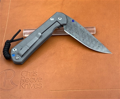 Large Sebenza 31 Plain Drop Point - Raindrop Damascus