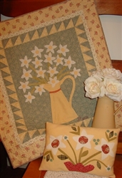 This warm, vintage wool & fabric wall hanging looks great in any setting and can even be used as a table topper!