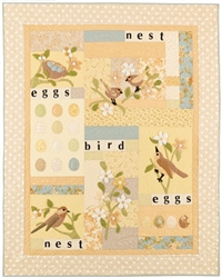 Soft quilt with sweet applique birds, flowers, eggs and a nest