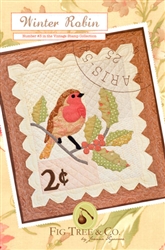 A vintage "stamp" wall hanging complete with an embroidered postmark and adorable red robin