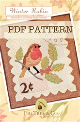 A vintage "stamp" wall hanging complete with an embroidered postmark and adorable red robin