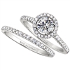Single diamond halo engagement ring & wedding band