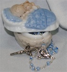 Blue Porcelain Baby in a Basket with a Rosary