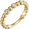 This 14k yellow gold diamond stackable ring features round diamonds.