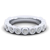 Smooth diamond bezels encompass round brilliant diamonds in this 14k white gold diamond ring.