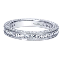 This unique diamond eternity band is studded with 0.90 carats of round brilliant diamonds in an eternity style.