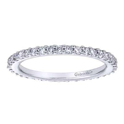 This 14k white gold diamond eternity band uses over one half carats of round brilliant diamonds to wrap around 14k white gold in this never-ending diamond band!