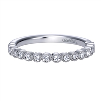 This simple and stylish diamond wedding band is featured in 14k white gold, to go along with 0.17 carats of round brilliant diamonds.