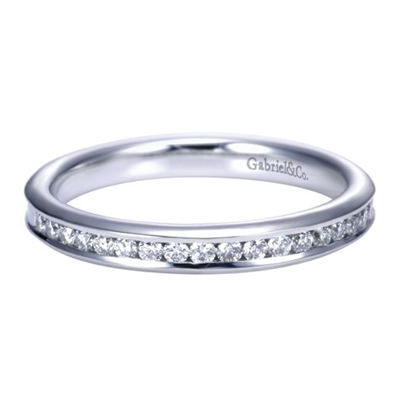 Beautiful round diamonds are set into a 14k white gold channel in this fresh and classic white gold diamond wedding band!