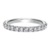 Glittering round diamonds sit pretty in 14k white gold in this diamond laden wedding band by Gabriel & Co.