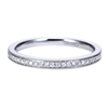 This 14k white gold diamond wedding band is simple but flashes elegantly with beaded white gold rows surrounding channel set round diamonds.