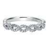 This 14k white gold diamond wedding band features white gold bands that loop around one another for a beautiful effect!