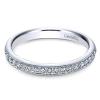 This milgrained 14k white gold diamond band features 0.26 carats of round brilliant diamonds.