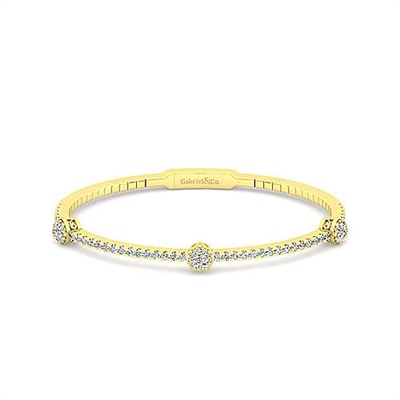 This 14k yellow gold diamond bangle bracelet showcases 0.92 carats of round brilliant diamonds set in warm 14k yellow gold.