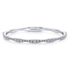 This bangle bracelet features a unique style and flair with over 1 carat of round brilliant diamonds that are set into gorgeous 14k white gold.