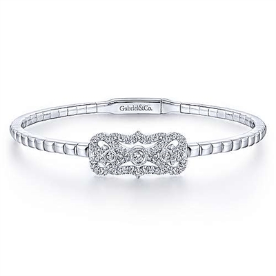This white gold diamond bangle with a vintage style features nearly one half carats of round brilliant diamond shimmer.