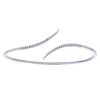 This simple and chic diamond wave cuff features over one quarter carats of round diamonds.