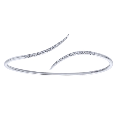 This simple and chic diamond wave cuff features over one quarter carats of round diamonds.