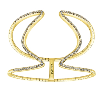 This curved yellow gold cuff features over one carat of round diamonds brilliantly emblazoned over 14k yellow gold in this large cuff bracelet.