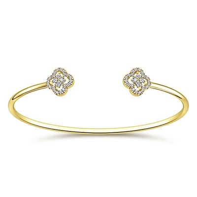 Two center diamond sections create this 14k yellow gold diamond cuff bracelet.