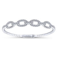 1.38 carats of brilliant diamond shine are set into this 14k white gold cuff bangle.