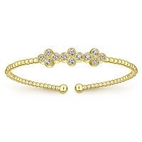 12 round brilliant diamonds shine with 0.61 carats all in this 14k yellow gold cuff bracelet.