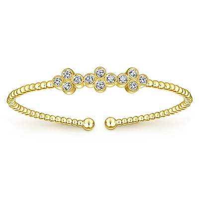 12 round brilliant diamonds shine with 0.61 carats all in this 14k yellow gold cuff bracelet.