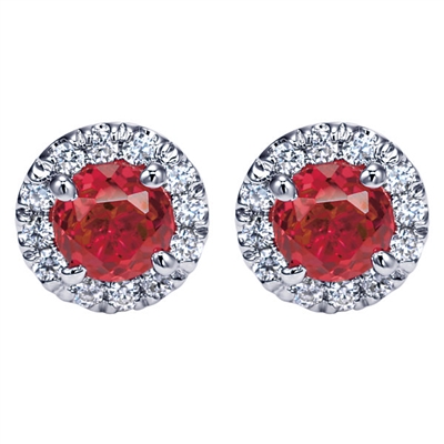 Shimmering red rubies fill in the center of these diamond and ruby stud earrings with a halo  in 14k white gold.